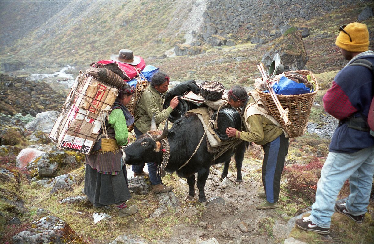 24 Egg Lady and Yak Herders Fixing Yak Loads On The Descent From Shao La To Joksam Tibet